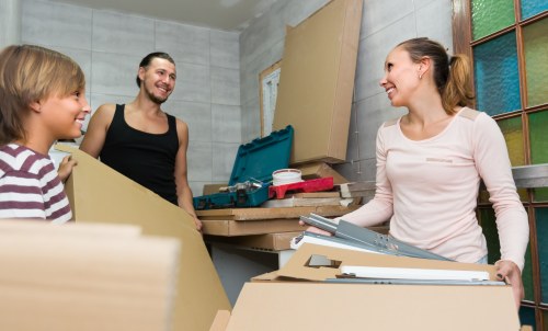 Local movers handling furniture in a commercial property near Southgate