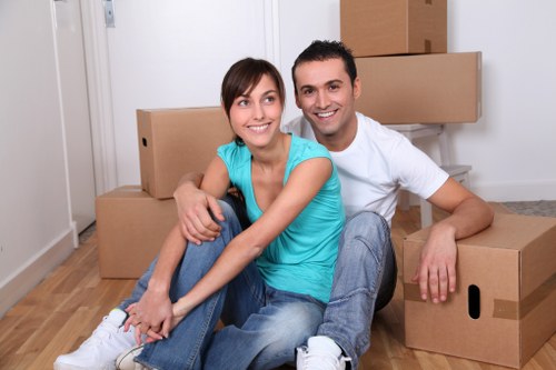Mover carrying items safely from a property during a removal job
