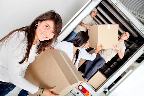 Loading household furniture into a removal truck