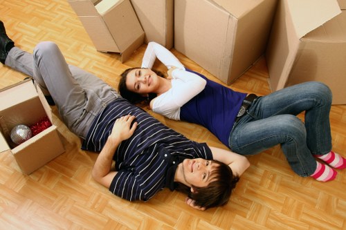 Packed office boxes and furniture ready for relocation in Southgate