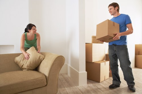 Movers loading furniture and boxes for a short-notice relocation